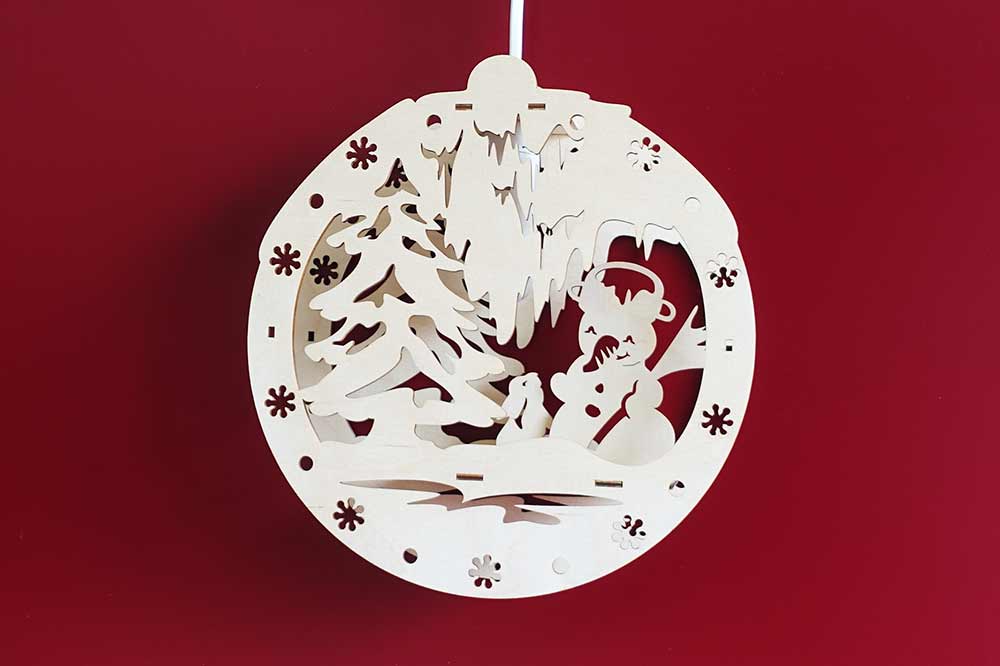 Fensterbild beleuchtet Winterlandschaft mit Schneemann